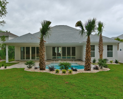 backyard with pool and palms