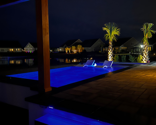 neon pool lighting outdoor patio at night